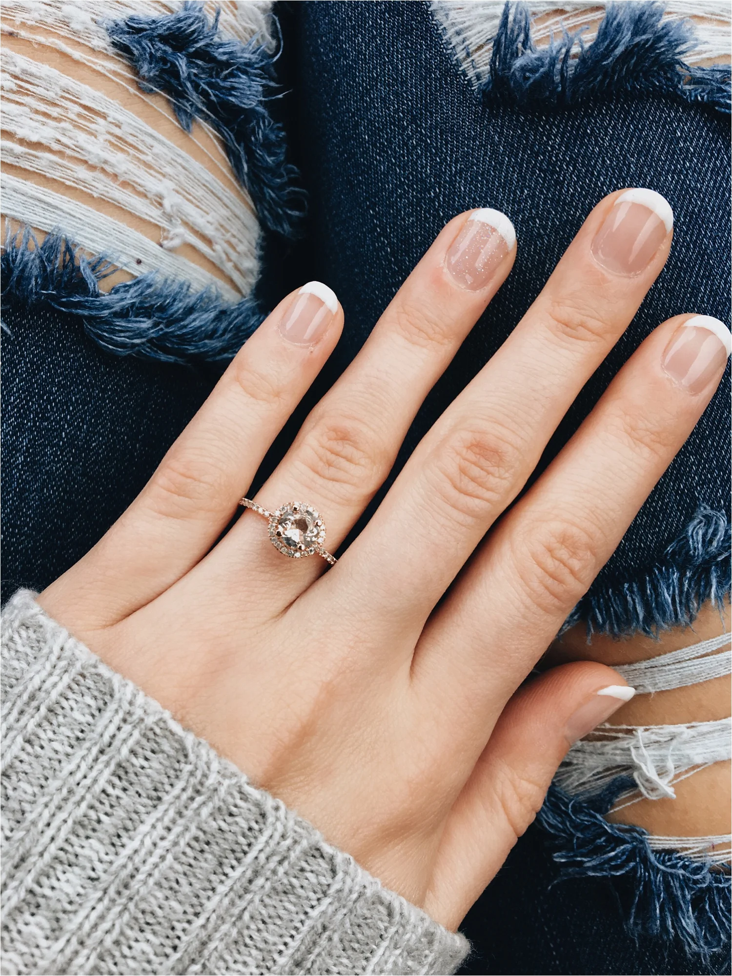  Didn't he pick the most beautiful ring? <3 The center stone is morganite and it's surrounded by tiny diamonds. I also really love the rose gold! 