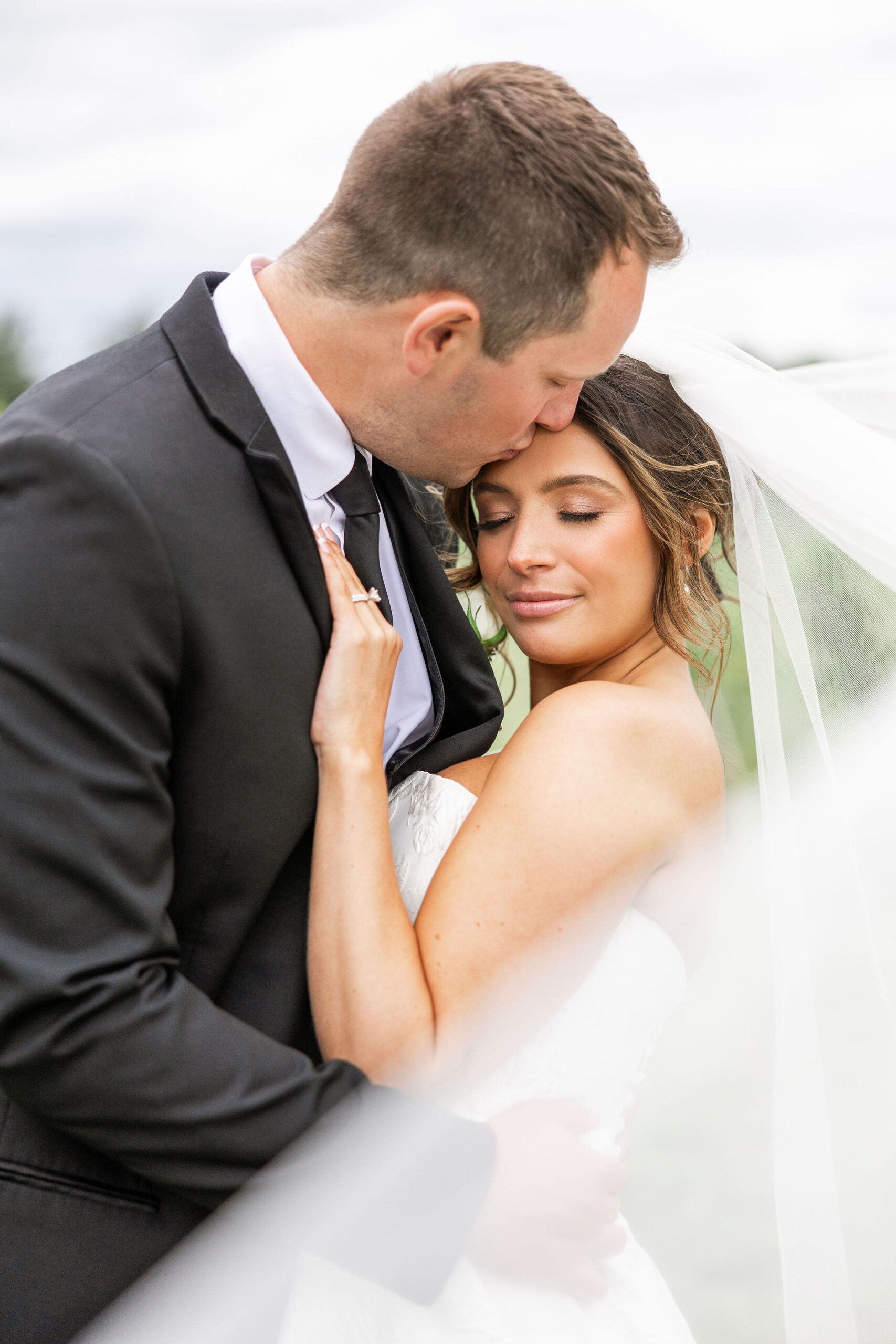 the vineyards at pine lake wedding bride and groom veil